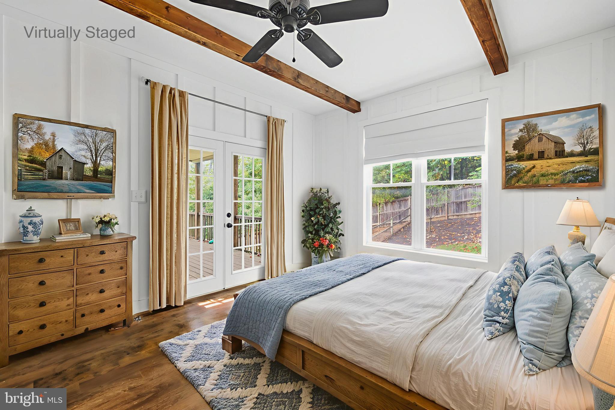 540 Mcdonalds Farm Road Linden, VA 22642 - Photo 26 of 60 a bedroom with a bed and a flat screen tv