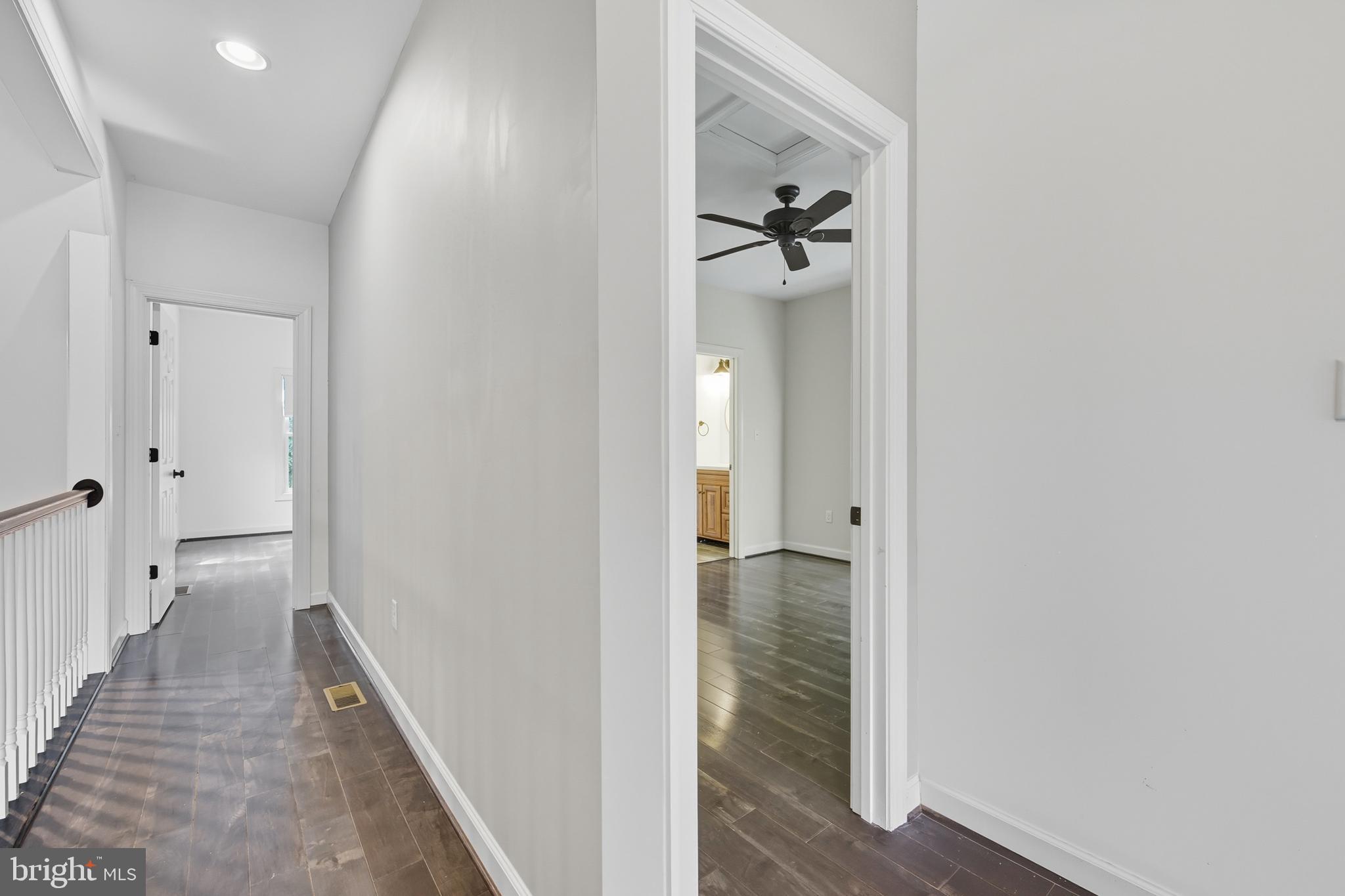 540 Mcdonalds Farm Road Linden, VA 22642 - Photo 31 of 60 a view of a hallway with wooden floor and staircase