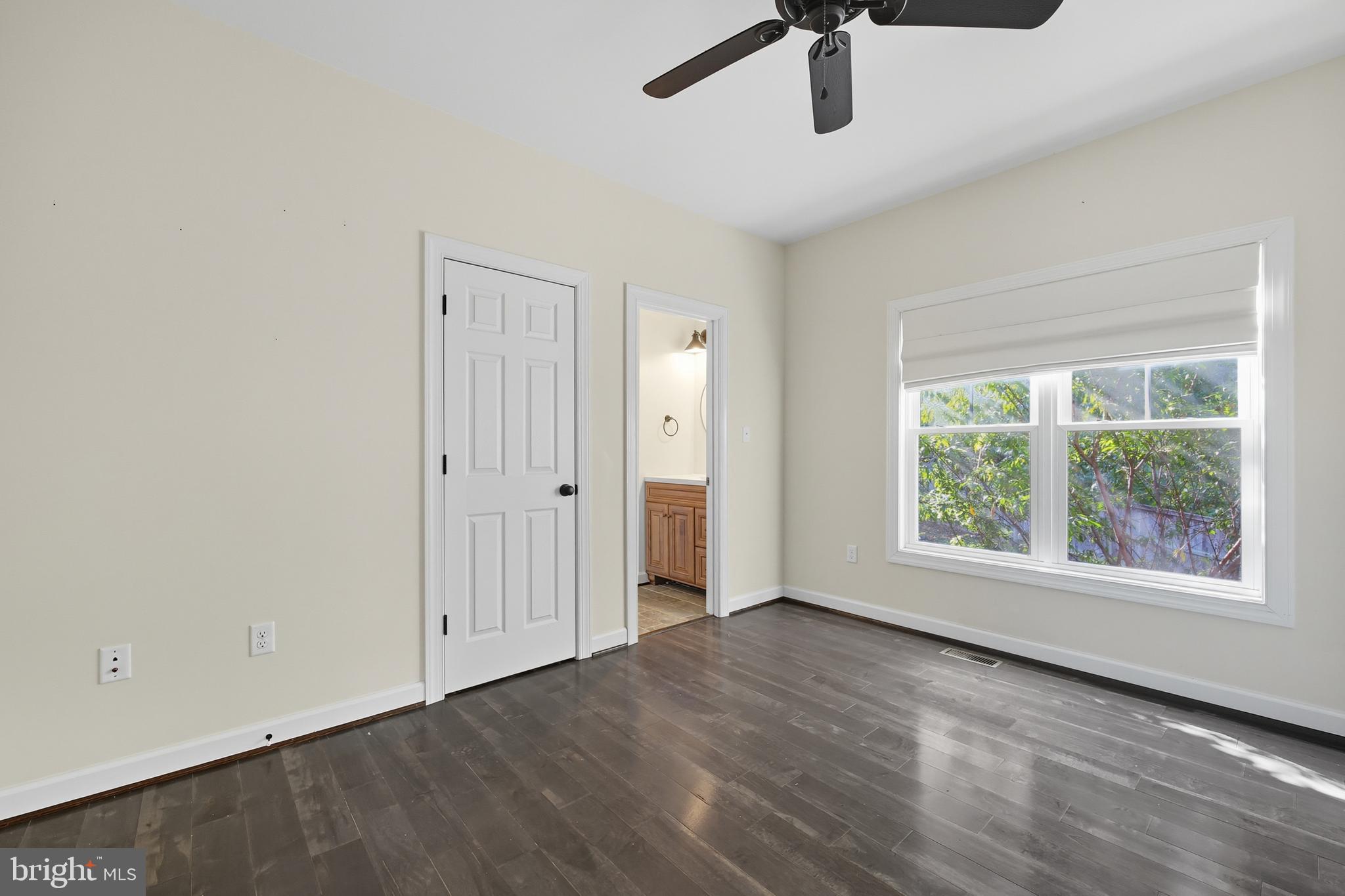 540 Mcdonalds Farm Road Linden, VA 22642 - Photo 33 of 60 an empty room with wooden floor fan and windows