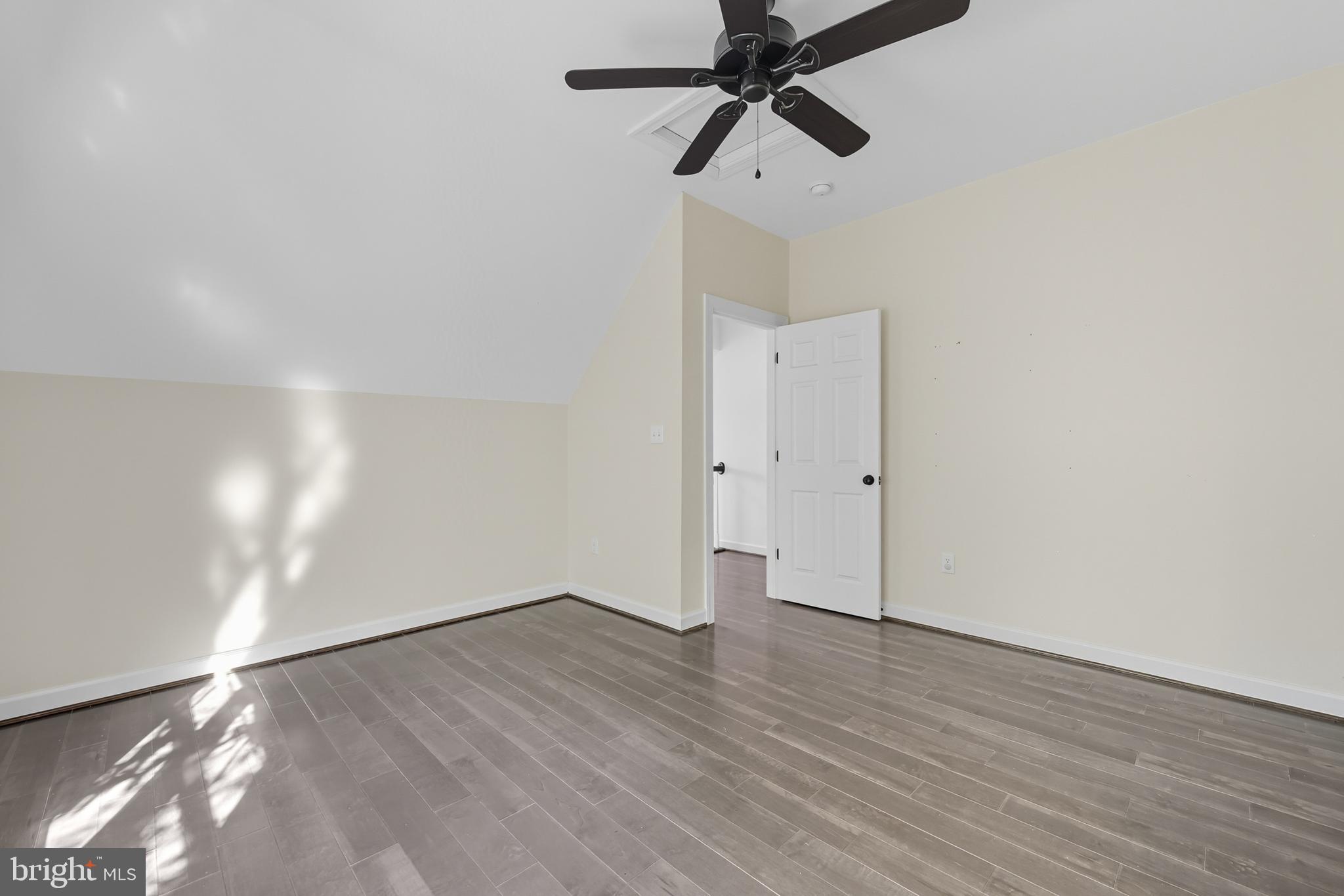 540 Mcdonalds Farm Road Linden, VA 22642 - Photo 34 of 60 an empty room with wooden floor and windows