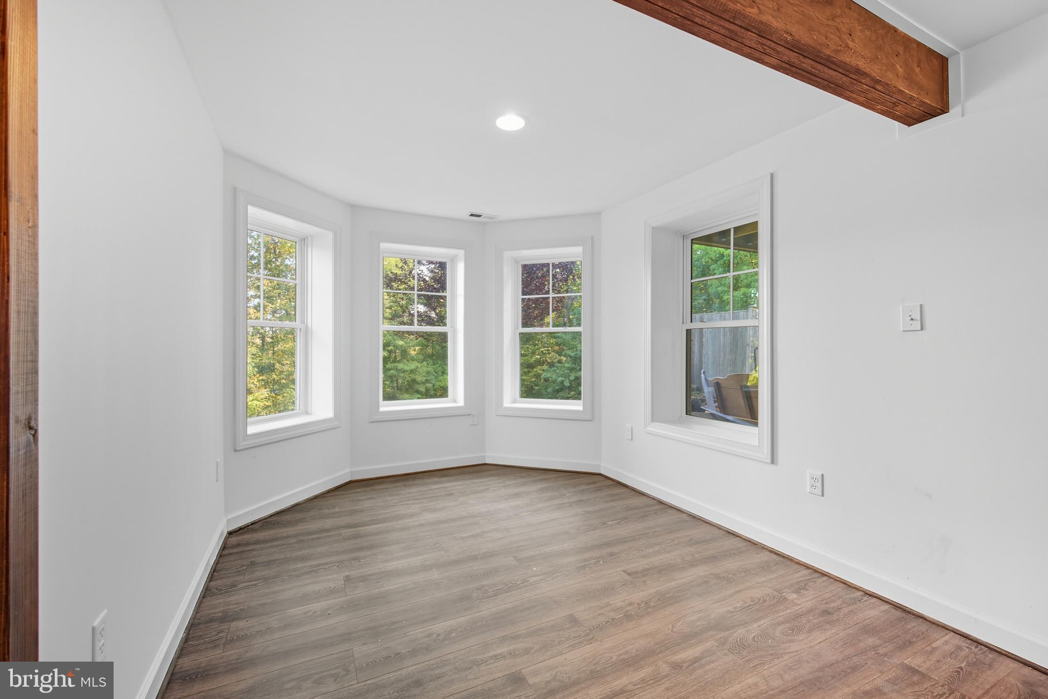 540 Mcdonalds Farm Road Linden, VA 22642 - Photo 44 of 60 an empty room with wooden floor and windows