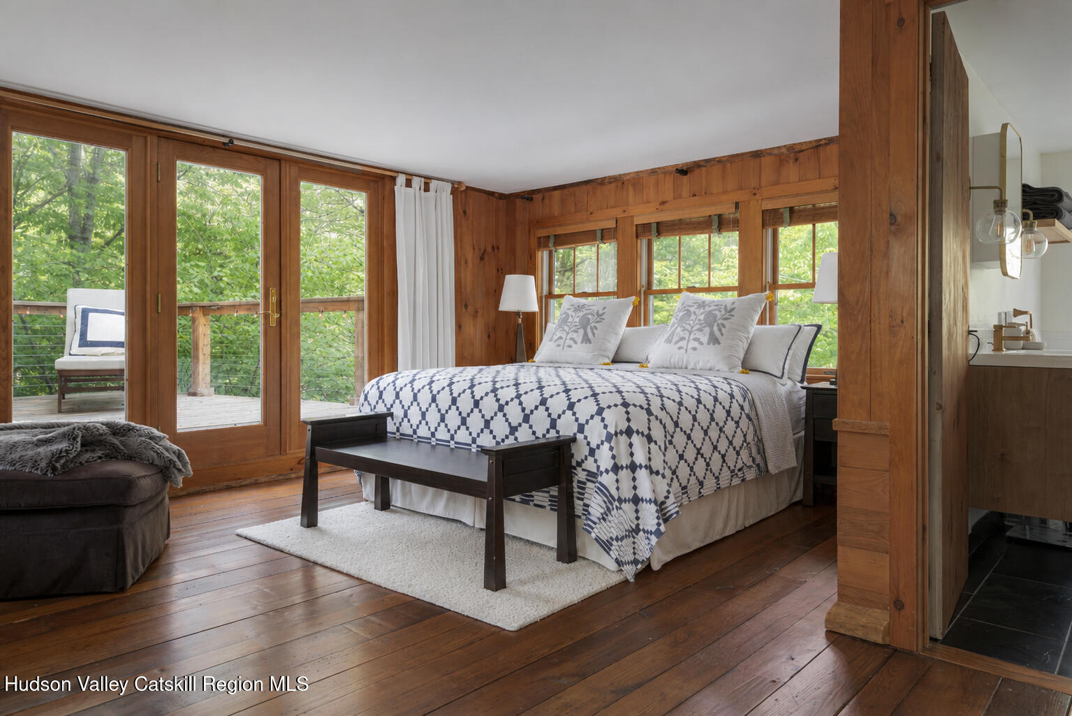 22 Old Mill Road Stephentown, NY 12169 - Photo 25 of 55 a bedroom with a bed and wooden floor