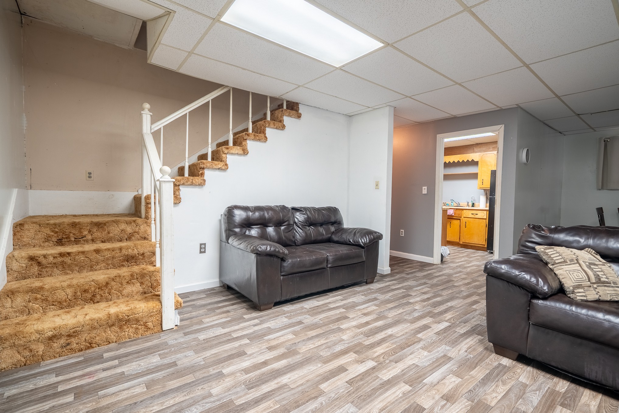 75 Buie Road Summertown, TN 38483 - Photo 16 of 27 a living room with furniture and stairs