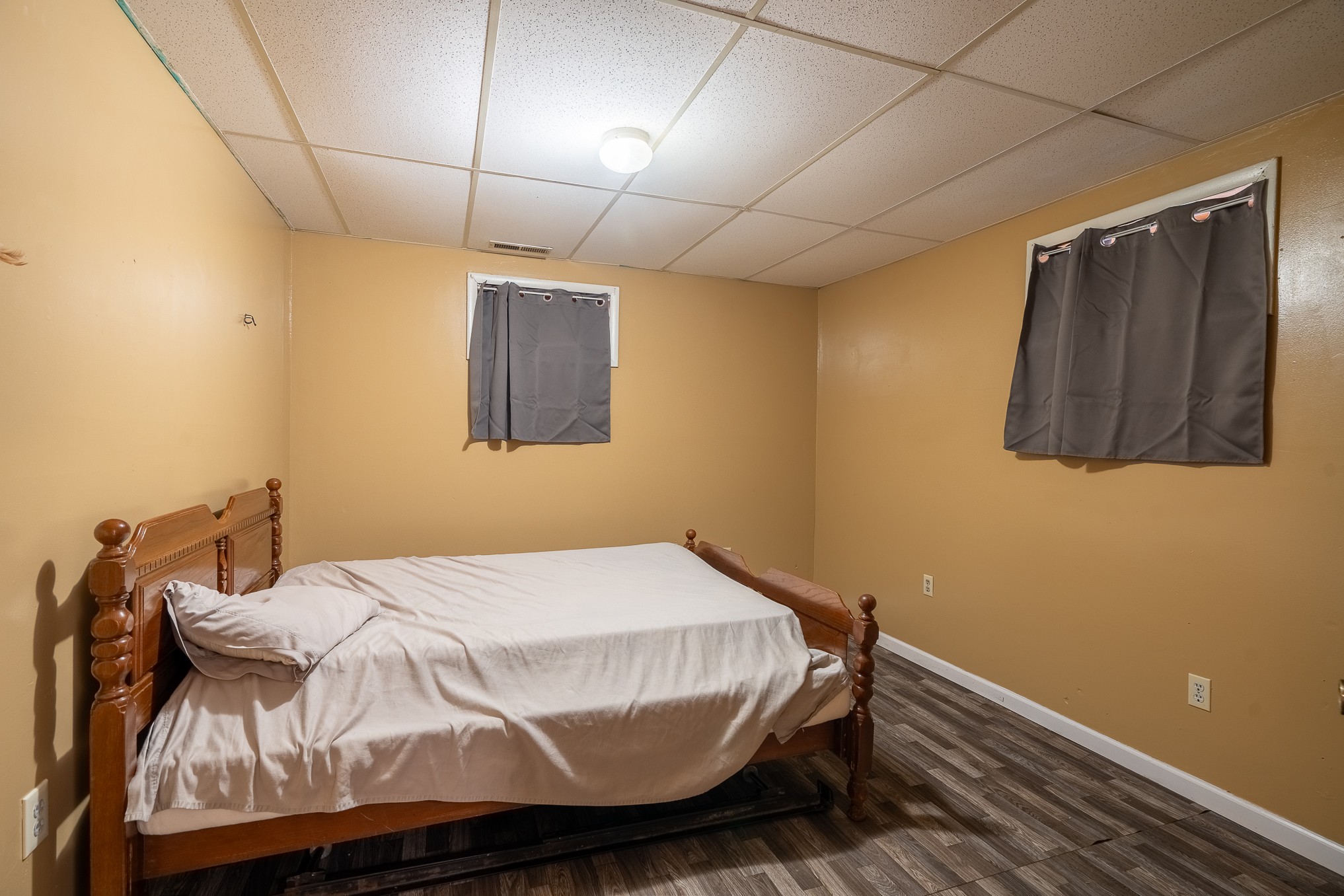 75 Buie Road Summertown, TN 38483 - Photo 20 of 27 a bedroom with a bed and a wall painting