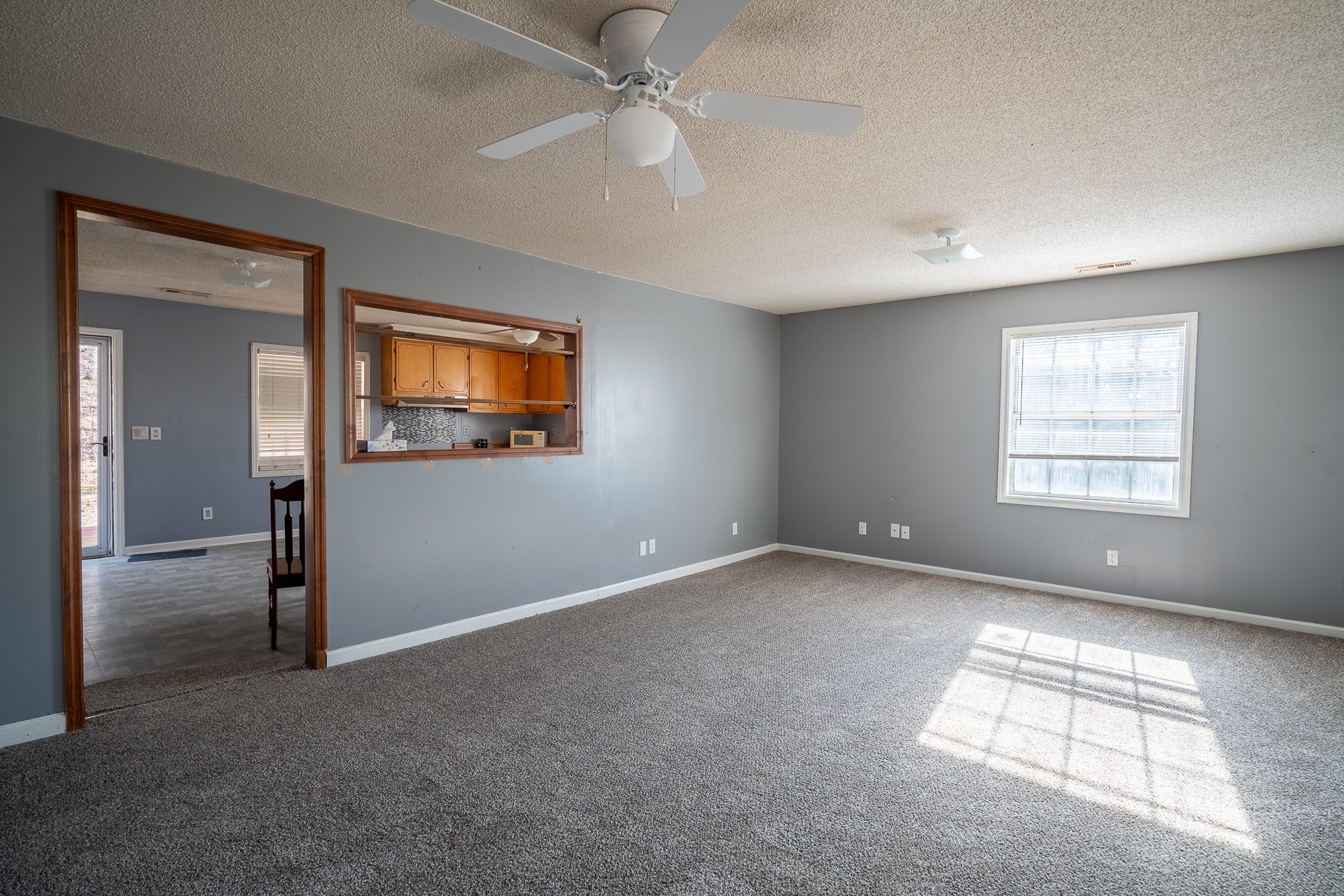 75 Buie Road Summertown, TN 38483 - Photo 5 of 27 an empty room with windows and fan