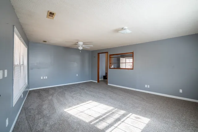 a view of an empty room with a window