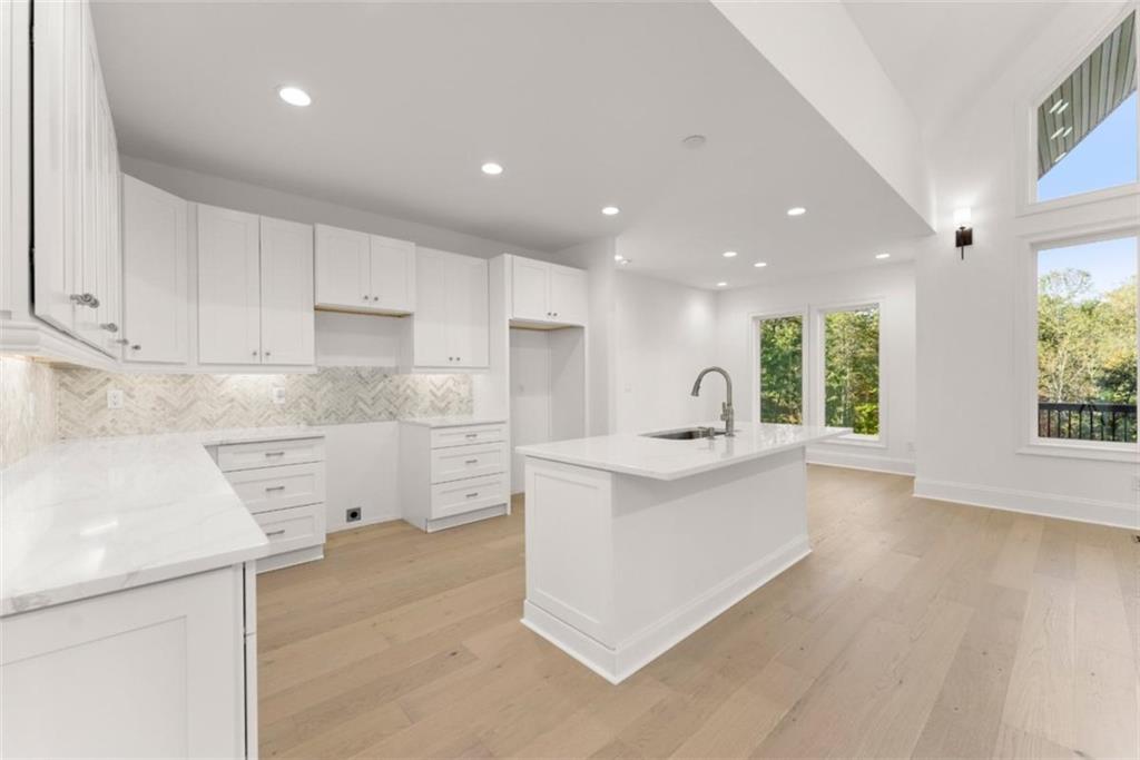 2123 Goat Neck Road Cleveland, GA 30528 - Photo 19 of 66 a kitchen with white cabinets and sink
