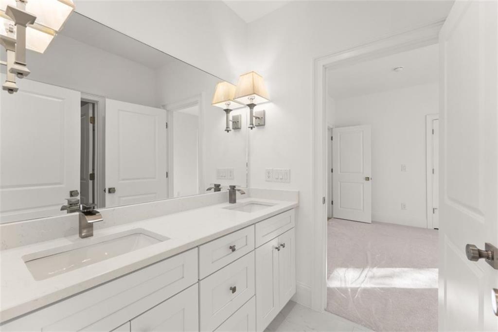 2123 Goat Neck Road Cleveland, GA 30528 - Photo 26 of 66 a bathroom with a sink and a mirror