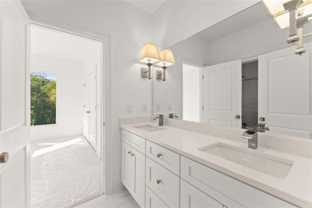 2123 Goat Neck Road Cleveland, GA 30528 - Photo 27 of 66 a bathroom with a sink and a mirror