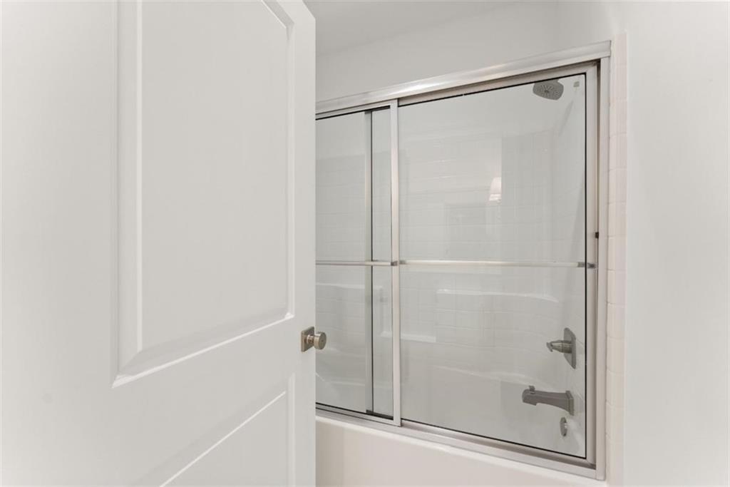 2123 Goat Neck Road Cleveland, GA 30528 - Photo 28 of 66 a bathroom with a glass shower door