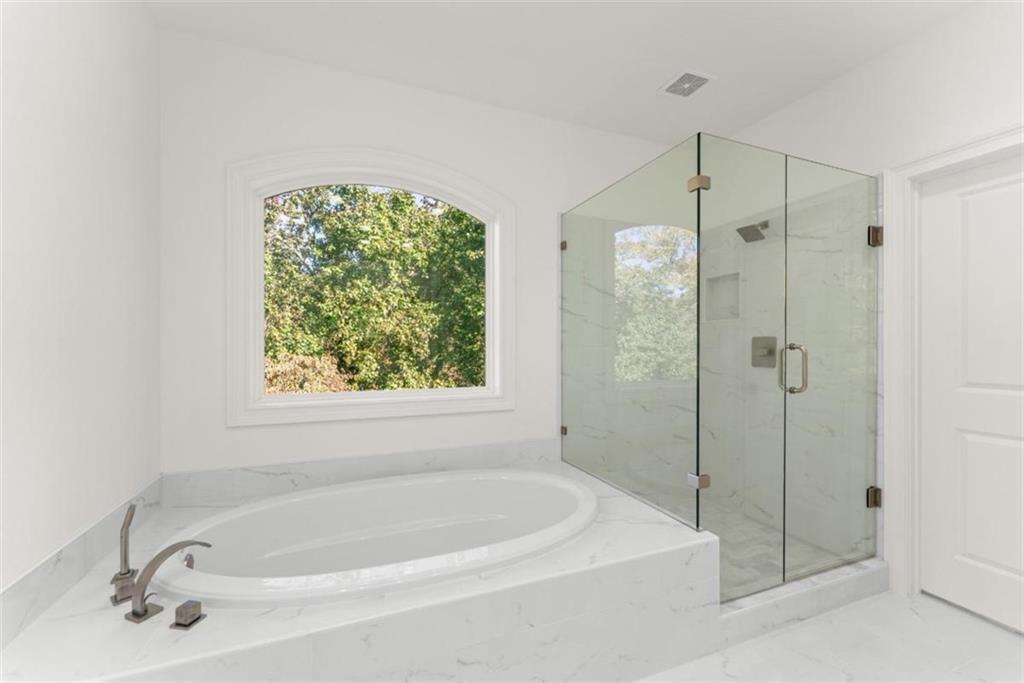 2123 Goat Neck Road Cleveland, GA 30528 - Photo 39 of 66 a white bath tub sitting next to a shower