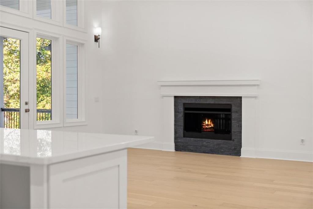 2123 Goat Neck Road Cleveland, GA 30528 - Photo 46 of 66 a view of an empty room with a fireplace and a window