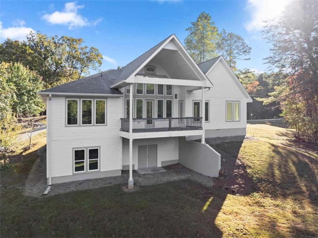 2123 Goat Neck Road Cleveland, GA 30528 - Photo 53 of 66 a front view of a house with a yard and garage