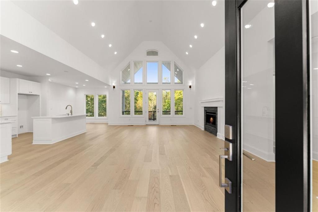 2123 Goat Neck Road Cleveland, GA 30528 - Photo 10 of 66 a view of an empty room and a kitchen with electric equipment