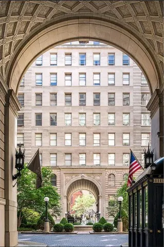 a living room with furniture large window and outdoor view