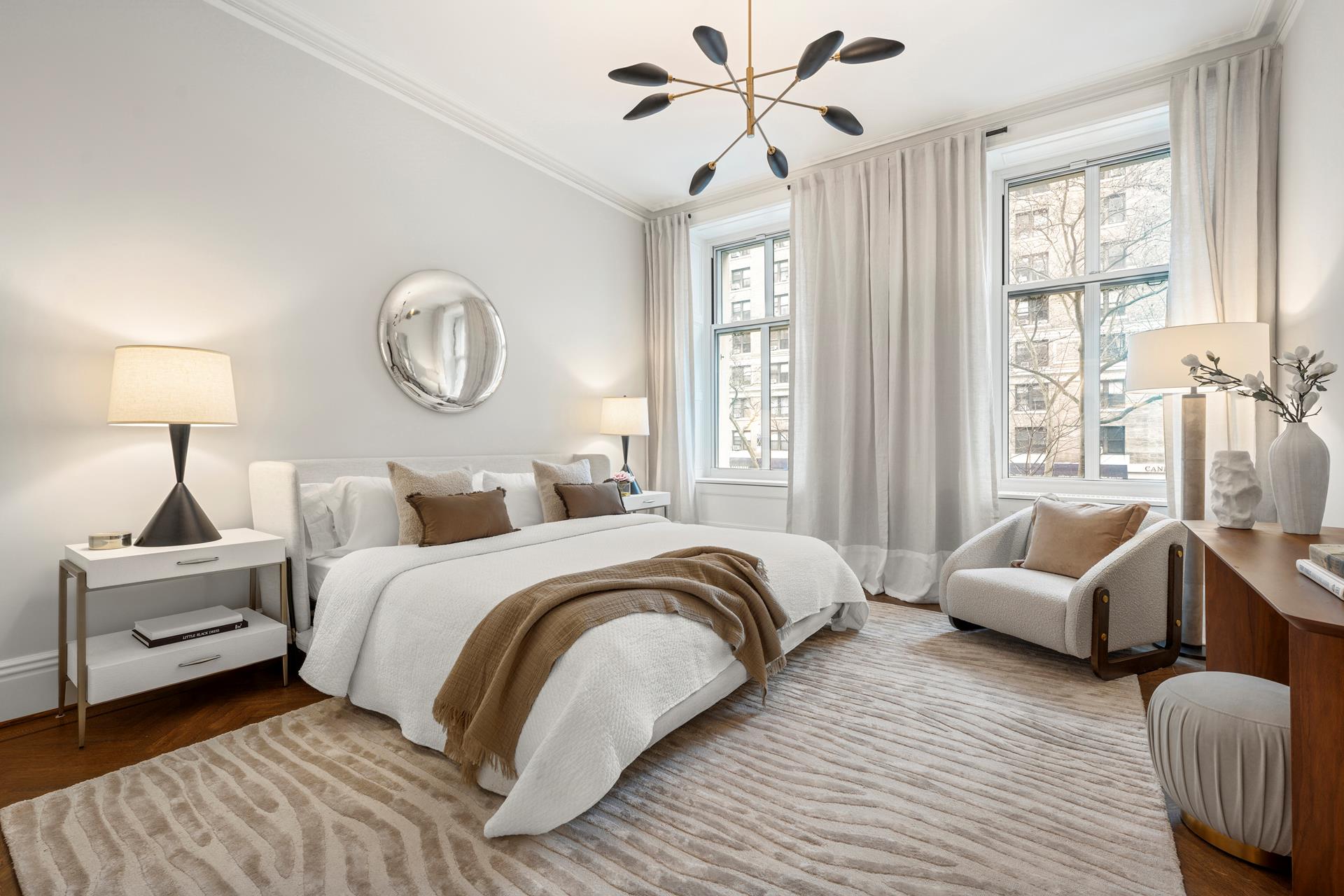 390 West End Avenue, Unit 2A Manhattan, NY 10024 - Photo 9 of 27 a bedroom with a bed and a chandelier