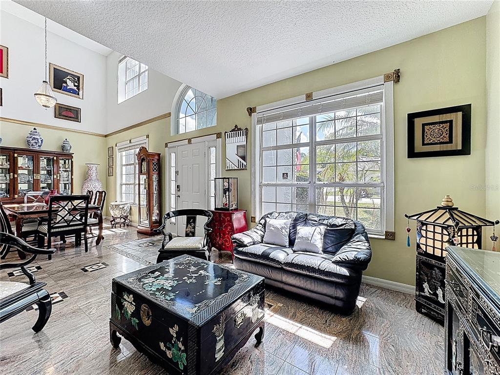 2048 Applegate Drive Ocoee, FL 34761 - Photo 14 of 61 a living room with furniture and a window
