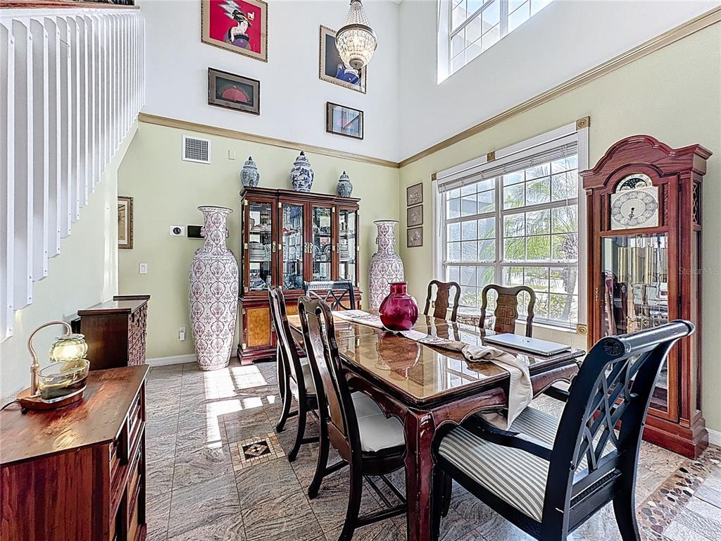 2048 Applegate Drive Ocoee, FL 34761 - Photo 16 of 61 a view of a dining room with furniture window and wooden floor