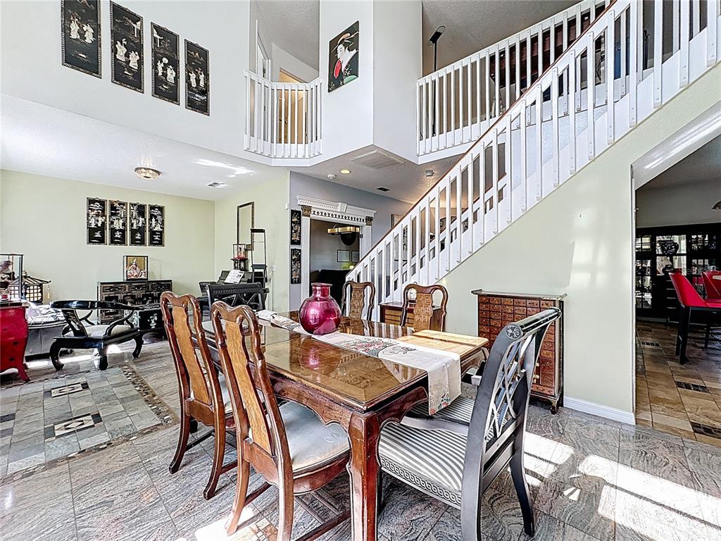 2048 Applegate Drive Ocoee, FL 34761 - Photo 18 of 61 a view of a dining room with furniture and wooden floor