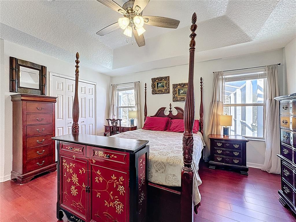 2048 Applegate Drive Ocoee, FL 34761 - Photo 20 of 61 a bedroom with a bed and a dresser in it