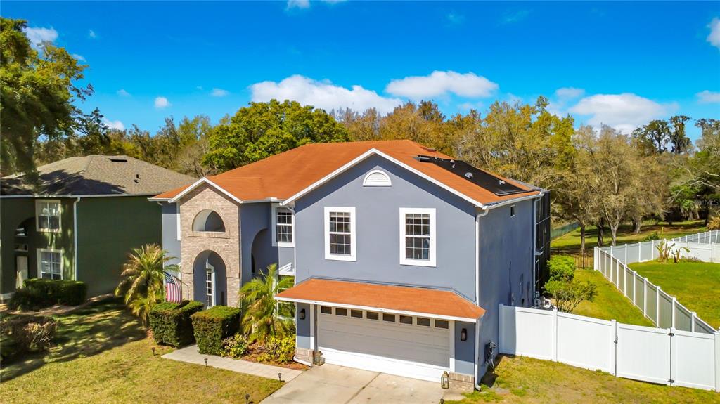 2048 Applegate Drive Ocoee, FL 34761 - Photo 2 of 61 a view of a house with a backyard