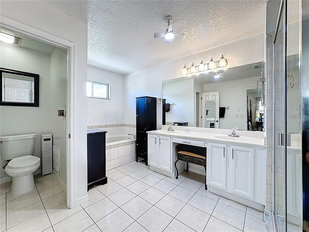 2048 Applegate Drive Ocoee, FL 34761 - Photo 23 of 61 a spacious bathroom with a double vanity sink and a mirror