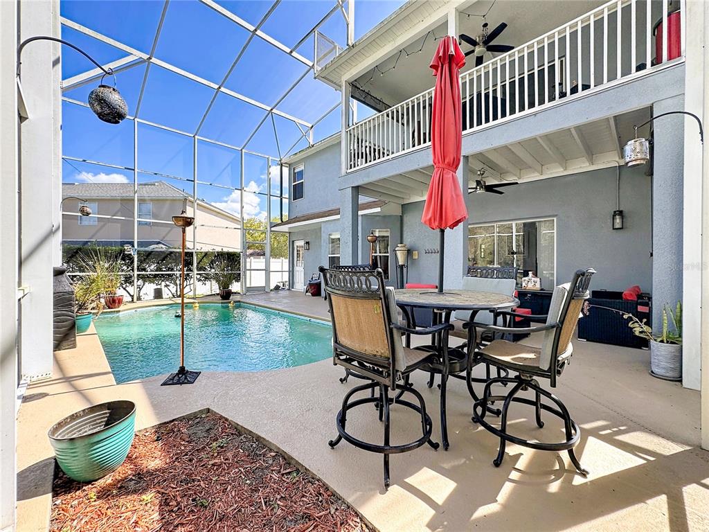 2048 Applegate Drive Ocoee, FL 34761 - Photo 30 of 61 a dining area with glass top table and chairs