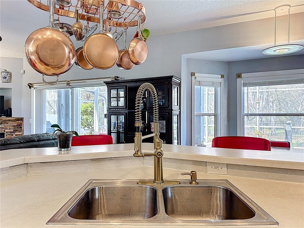 2048 Applegate Drive Ocoee, FL 34761 - Photo 50 of 61 a kitchen with a sink and a large mirror