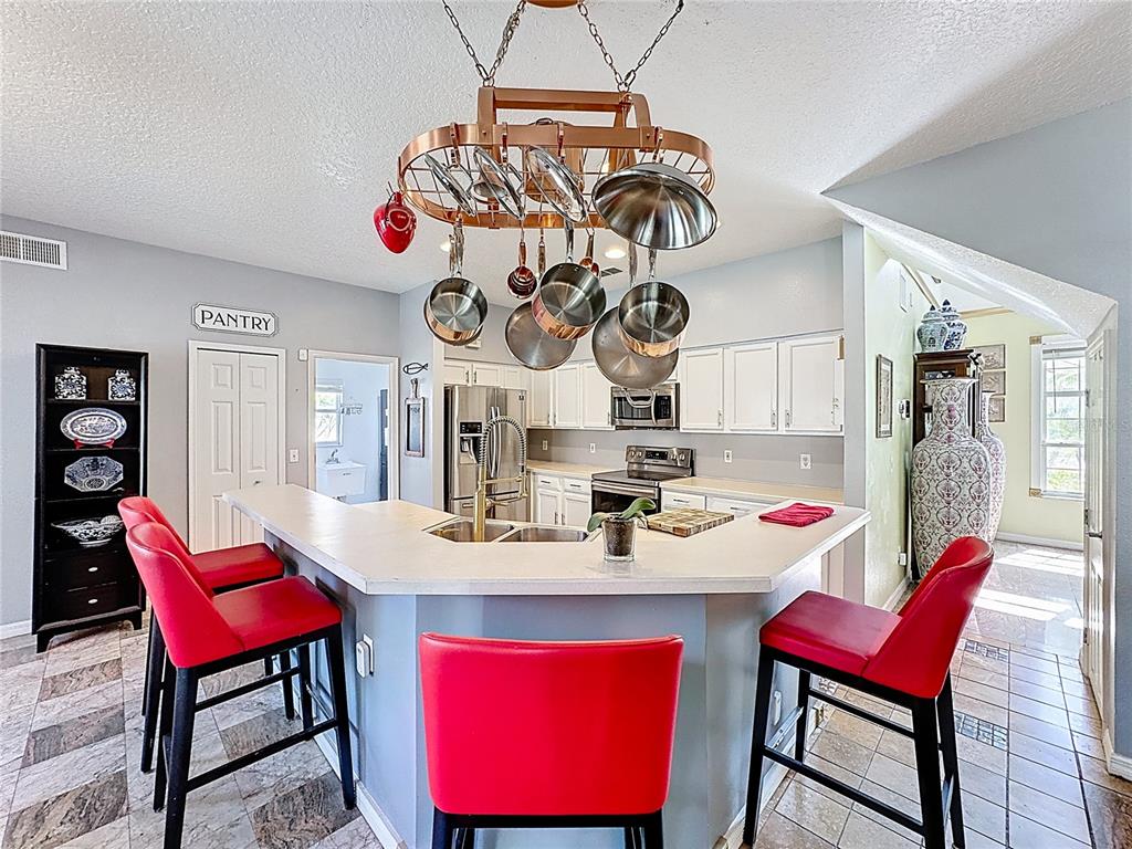 2048 Applegate Drive Ocoee, FL 34761 - Photo 51 of 61 a view of a dining room and red furniture