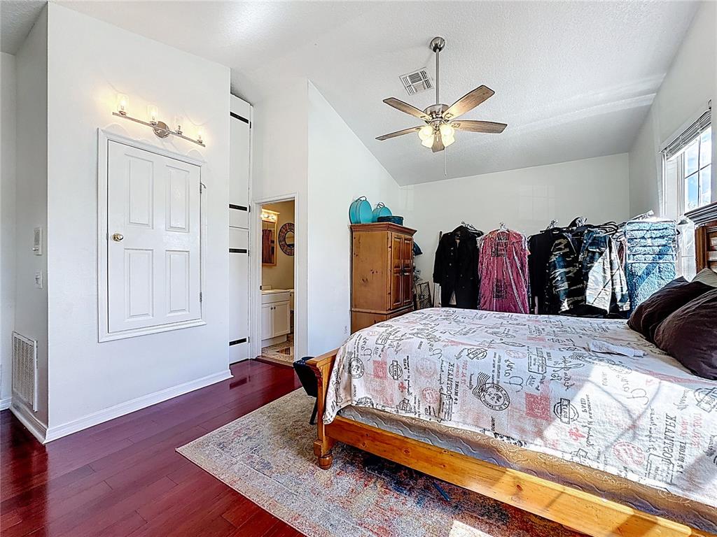 2048 Applegate Drive Ocoee, FL 34761 - Photo 53 of 61 a bedroom with bed and wooden floor