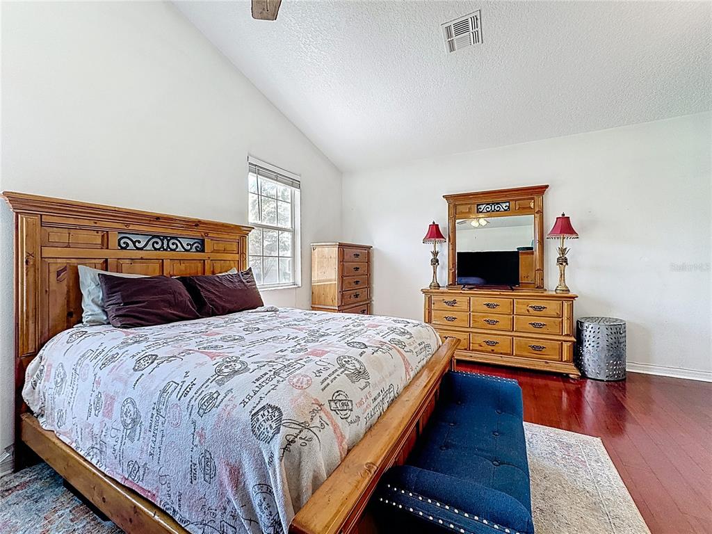 2048 Applegate Drive Ocoee, FL 34761 - Photo 54 of 61 a bedroom with bed and flat screen tv