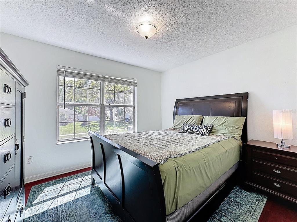 2048 Applegate Drive Ocoee, FL 34761 - Photo 55 of 61 a bedroom with a bed and a window