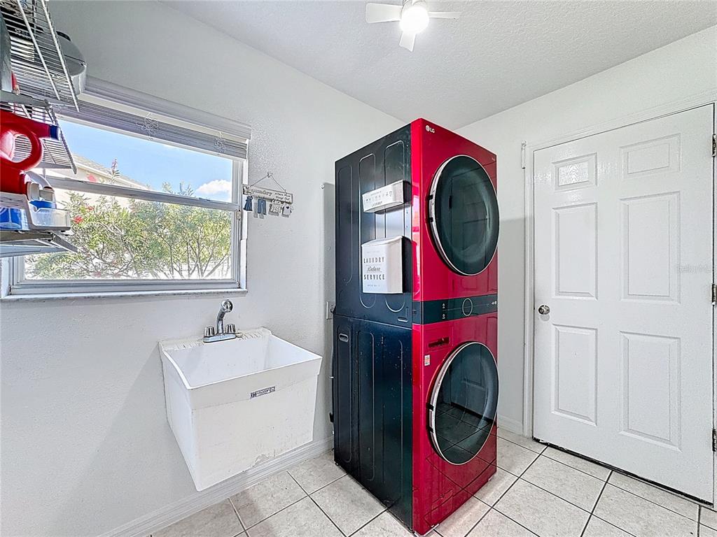 2048 Applegate Drive Ocoee, FL 34761 - Photo 56 of 61 a utility room with dryer and washer
