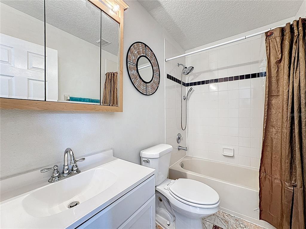 2048 Applegate Drive Ocoee, FL 34761 - Photo 57 of 61 a bathroom with a toilet sink and a mirror