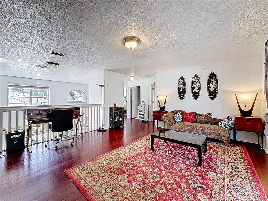 2048 Applegate Drive Ocoee, FL 34761 - Photo 6 of 61 a living room with furniture and wooden floor