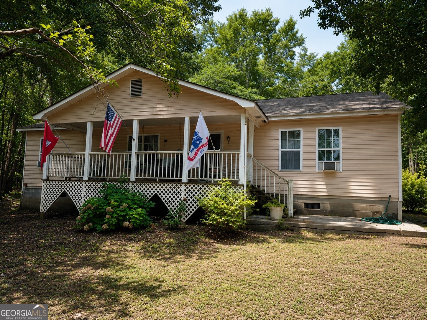 839 Cannafax Road Barnesville, GA 30204 - Photo 1 of 10 a front view of a house with garden
