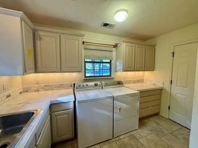 a utility room with dryer and washer