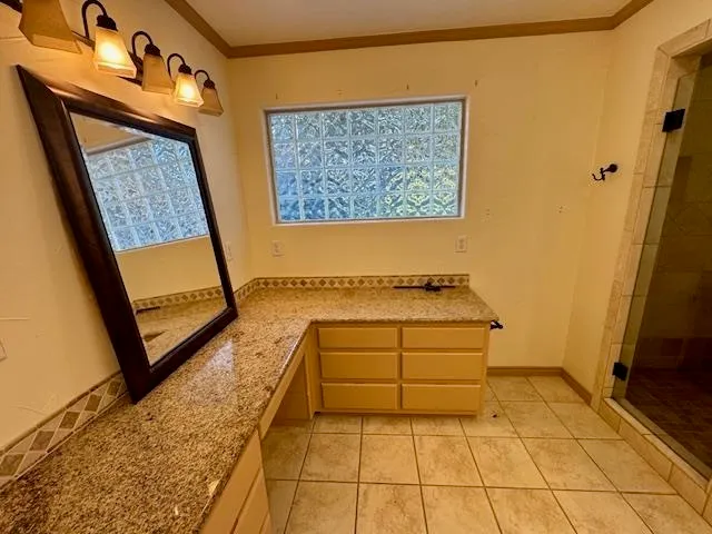 a bathroom with a tub sink and a mirror