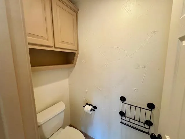 a bathroom with a toilet a sink and a bathtub