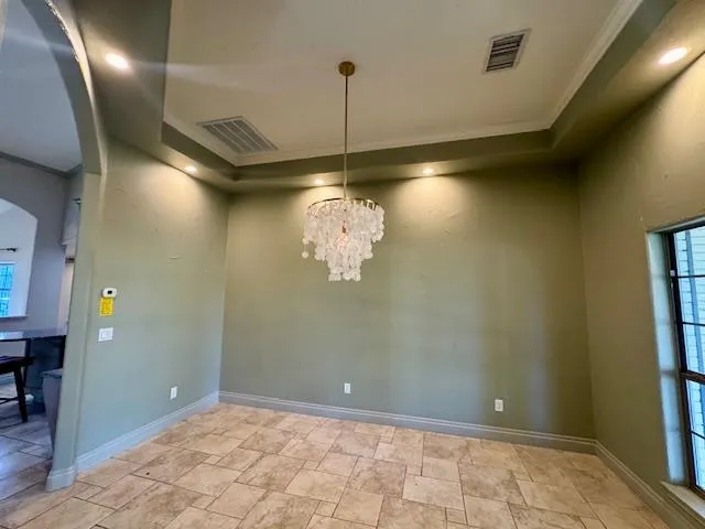 a view of a chandelier in big room