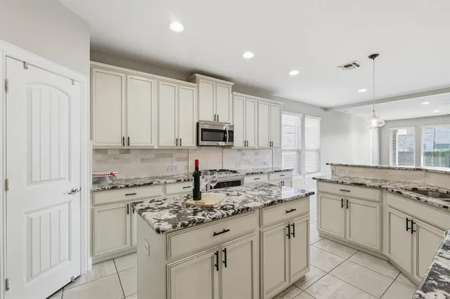 a large bathroom with a sink and a large mirror