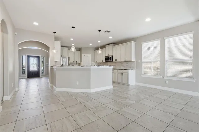 a bathroom with a bathtub and a sink
