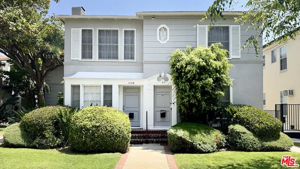 front view of a house with a garden