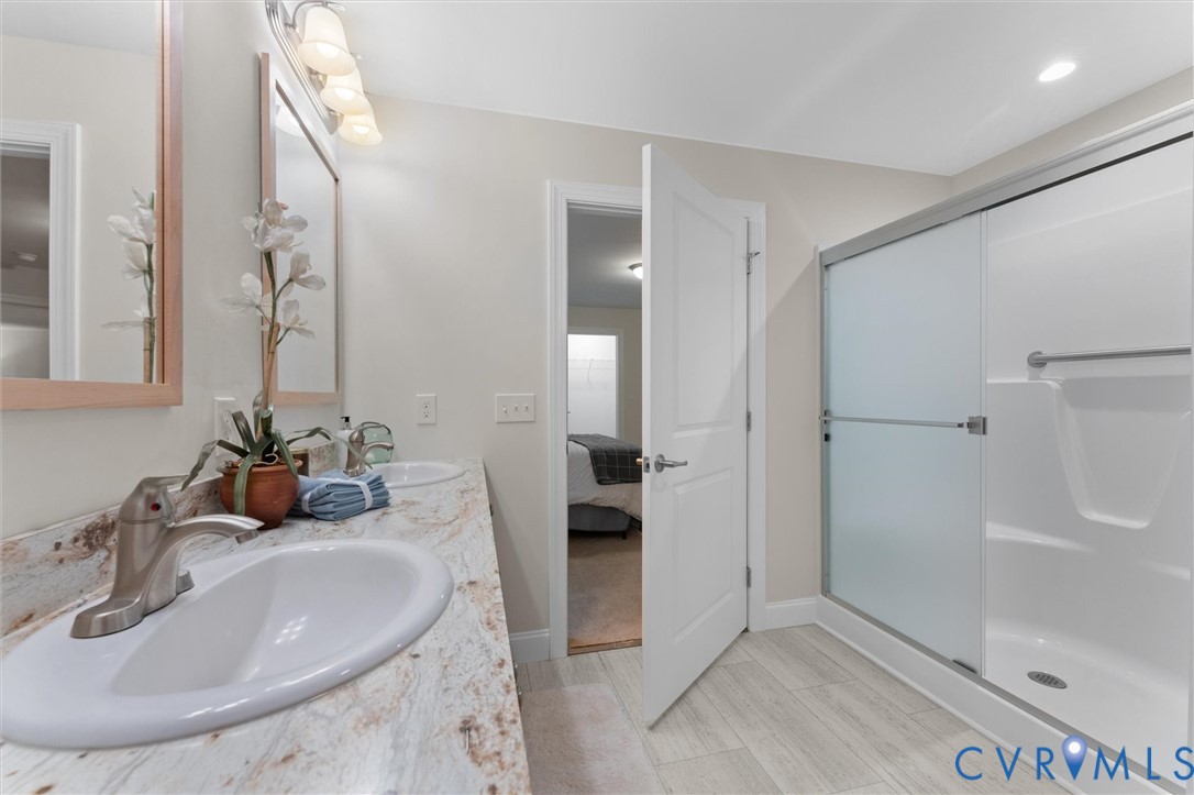 5239 Old Buckingham Road Powhatan, VA 23139 - Photo 36 of 50 a bathroom with a sink and a mirror