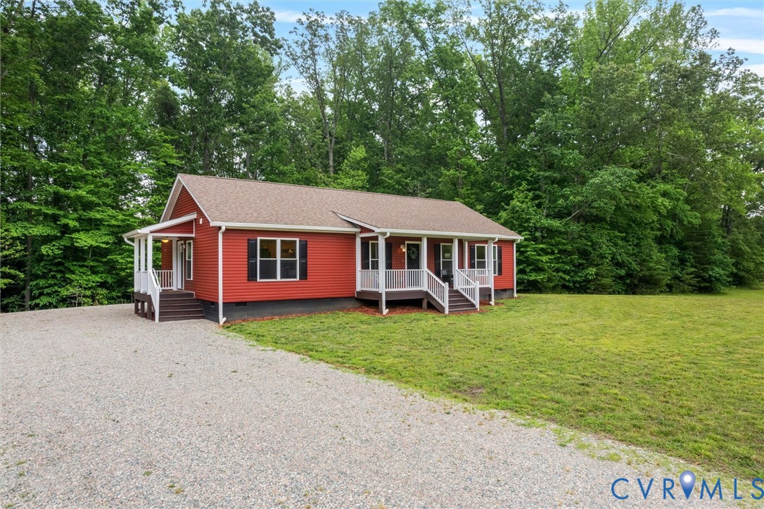 5239 Old Buckingham Road Powhatan, VA 23139 - Photo 4 of 50 a front view of a house with a garden