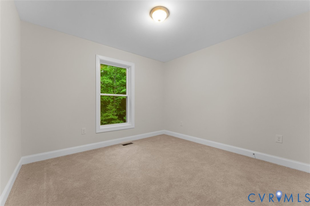 5239 Old Buckingham Road Powhatan, VA 23139 - Photo 44 of 50 an empty room with a window