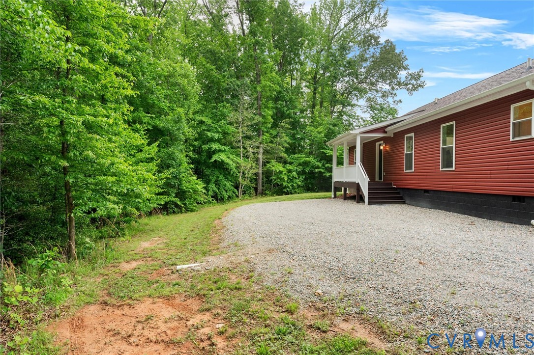 5239 Old Buckingham Road Powhatan, VA 23139 - Photo 49 of 50 a view of a backyard with large trees