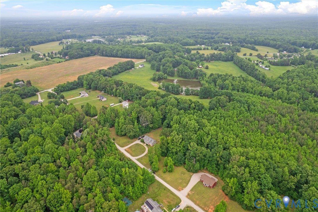 5239 Old Buckingham Road Powhatan, VA 23139 - Photo 7 of 50 an aerial view of residential houses with outdoor space and trees