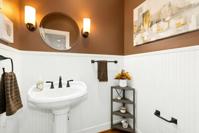 a bathroom with a sink and mirror