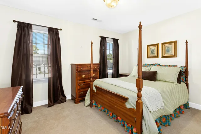 a bed room with a bed and a window